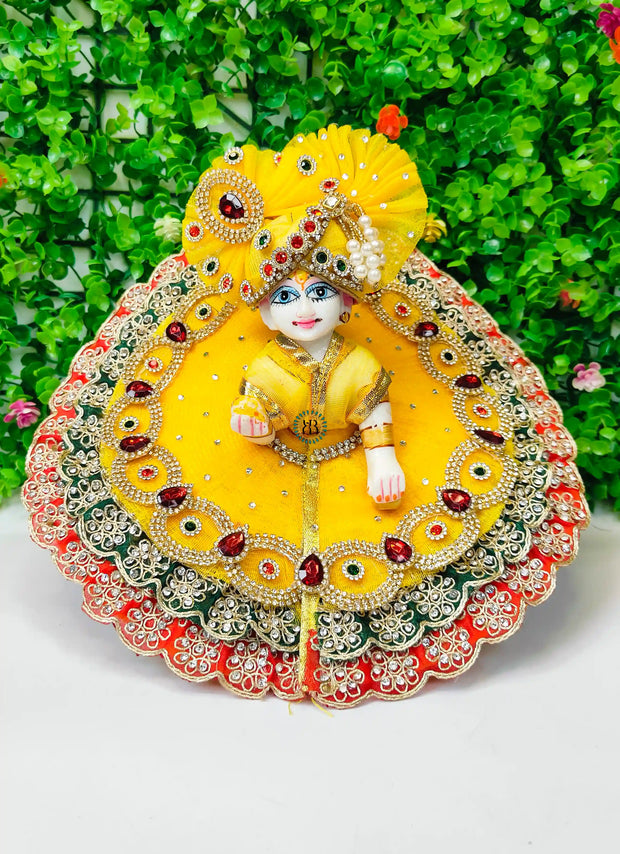 Festive special Yellow heavy dress with red and green lace combination with pagdi and choli